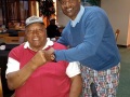 Boxing legend James "Bonecrusher" Smith (left)  with Andrew Lamont Osborne, nephew of caddie Jerry "Hobo" Osborne